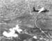 1944.unpainted.B26.over.the.city.retouched